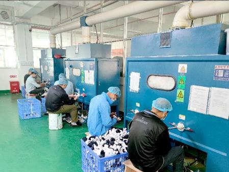 Cotton filling workshop with stuffing machines and baskets of filling