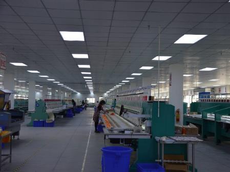 Computer embroidery workshop with rows of multi-head embroidery machines