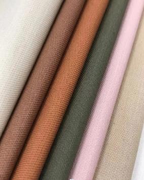 Fan of woven fabric swatches in cream, brown, orange, olive and pink