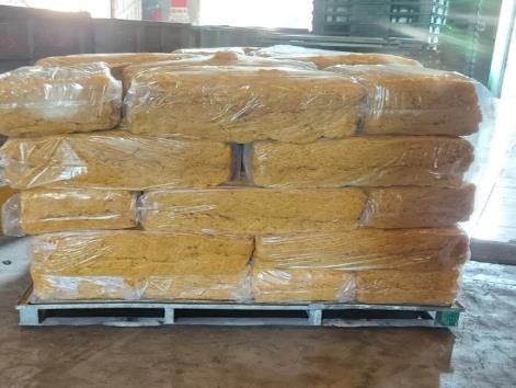 Shrink-wrapped foam blocks stacked on a pallet in the materials store